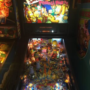 The Simpsons Pinball Party machine in a game room
