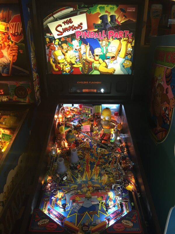 The Simpsons Pinball Party machine in a game room