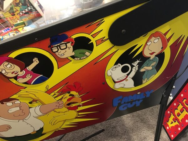 family guy pinball machine in a room