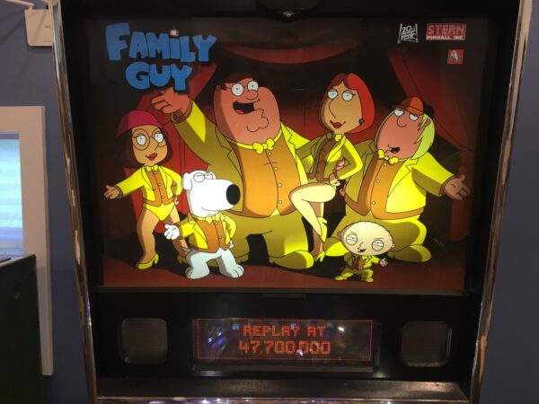 family guy pinball machine in a room