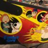 family guy pinball machine in a room