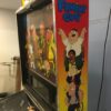 family guy pinball machine in a room