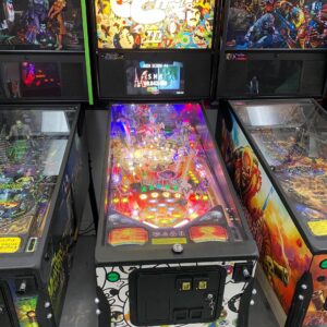 zeppelin pinball machine in a room of games