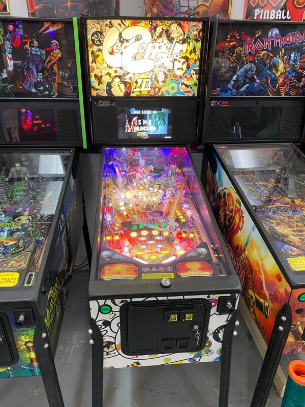 zeppelin pinball machine in a room of games